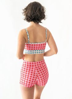 Introducing the Lime Ricki x Lars collaboration! If you're looking for a bottom option with more coverage, you've arrived. These comfy, high-waisted boy shorts are now in the charming Lars Pink Margrethe [Mar-great-uh] geometric daisy print inspired by the Queen of Denmark. Featuring a seamless front & comfortable leg openings, these will be your new favorite short for swimming, lounging, or working out. 80% nylon, 20% spandexProvides UV 50+ protectionFully linedSewn in the USA / Imported fabric Playful Short Length Swim Bottoms, Elastic High-waisted Swim Shorts, Moisture-wicking Multicolor Beach Shorts, Knot Crop Top, Summer Multicolor Swim Trunks With Built-in Shorts, Playful Cotton Swim Trunks With Built-in Shorts, Pink Floral Pattern, Daisy Print, Swim Top