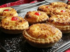 there are many small pies on the tray