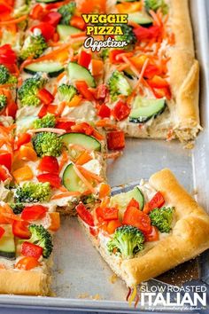 a vegetable pizza is cut into slices and sits on a baking sheet with the words veggie pizza appetizer written above it