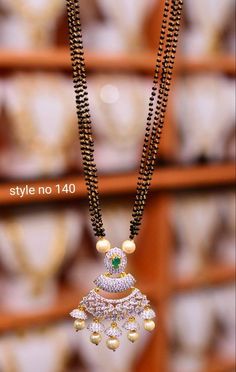 Beautiful one gram gold black bead with pendant.Locket studded with white and green color CZs.  10 January 2020 Pendant Locket, Beads Design, Gold Mangalsutra, Mangalsutra Designs, Black Beaded Jewelry, Krishna Radha, Jewelry Design Necklace, Bridal Gold Jewellery