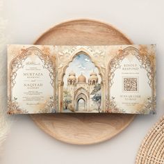 an ornate wedding card on top of a plate