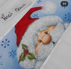 a close up of a santa clause on a white shirt