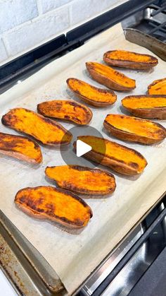 baked sweet potatoes on a baking sheet in an oven