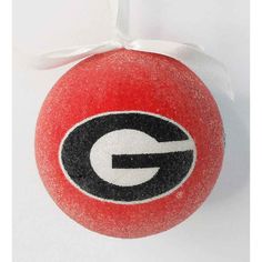 a red ornament with the university of georgia logo on it