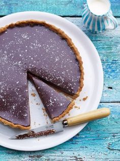 a pie sitting on top of a white plate