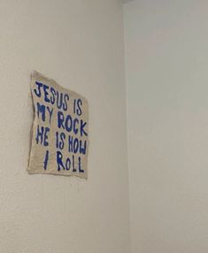 a sign on the wall that says jesus is my rock he is how i roll