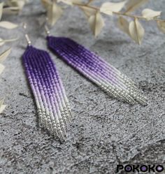 "These purple white silver seed bead earrings pair amazingly with any outfit, dressy or casual. They will emphasize your individuality and compliment your personality on various occasions. Perfect for looking pulled together and on trend. They are made of high-quality Czech colored beads with sterling silver hooks and silicone plugs. Colors: purple, white, silver. Length: 4.3 inches (11 cm) Width: 0.8 inches (2 cm) Materials:     Czech \"Preciosa\" beads     Durable synthetic thread     Sterling silver ear hooks     Silicone plugs If you are on the hunt for a gift that will show your significant other some love, these picks are a great solution to surprise and delight. I hope you can find everything here that you were looking for. If you have any questions related to earrings design, pleas Cheap Multicolor Beaded Earrings With Silver Beads, Beaded Earrings Native Beadwork Purple, Cheap Purple Beaded Earrings As Gift, Cheap Purple Beaded Earrings With Dangling Beads, Purple Fringe Earrings, Purple Seed Bead Earrings, Purple Beaded Earrings, Purple Fringe, Fringe Beaded Earrings