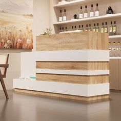 an empty counter in a store with bottles on the shelves behind it and a wooden chair next to it