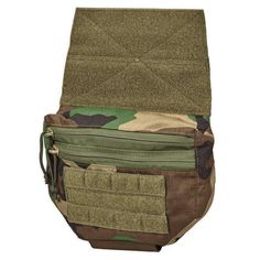 the back pocket of a camouflaged backpack with multiple pockets and zippers on it