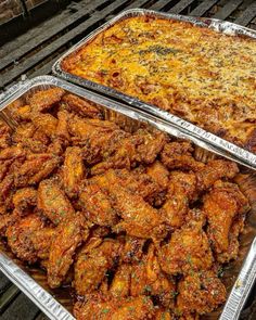 two trays filled with food sitting on top of a wooden table next to each other