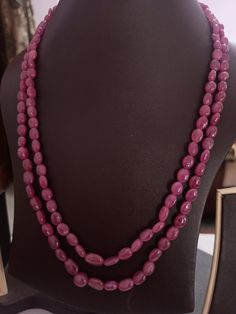 AAA 328 Carat Fine Quality Natural Ruby Smooth Plain 20 Inch Necklace Adjustable code Stone :Natural Ruby Shape :- fancy oval Necklace - 20 inch 2 line string Size :- 5x7mm to 8x11mm Weight :- 328 carat Polish :- Handmade Purity :- 100% Natural Gemstone color - red makes a great gift for your loved ones. It is known as the 'love stone' as the message it emits is the strong vibration of unconditional love, joy, warmth and healing. As quartz crystals are profound amplifiers of energy, it may help Formal Oval Necklace With Polished Beads, Oval Gemstone Beads Necklaces For Formal Occasions, Formal Oval Gemstone Beads Necklaces, Formal Oval Gemstone Beads Necklace, Elegant Gemstone Oval Beads, Oval Bead Gemstone Necklace For Formal Events, Formal Gemstone Necklace With Oval Beads, Formal Oval Bead Gemstone Necklace, Oval Single Strand Beaded Necklace As Gift