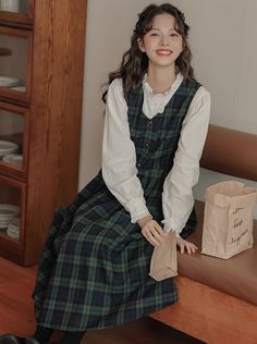 V-neck plaid pinafore dress with a button front, side pockets, adjustable back ties and pleated midi swing skirt. S: 34.5" chest, 42" lengthM: 36" chest, 42" lengthL: 37.5" chest, 42.5" lengthXL: 39" chest, 42.5" length Casual A-line Plaid Dress, Casual Fall Pinafore Dress For Workwear, Casual Plaid Midi Dress For Work, Casual Plaid Midi Length Dress, Casual Knee-length Pinafore Dress For Fall, Plaid Midi Length Dress For Daywear, Plaid Midi Dress For Daywear, Pinterest Wardrobe, Style Aesthetics