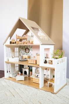 a doll house with furniture and accessories in it