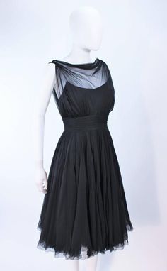 GALANOS Black Silk Chiffon Draped Cocktail Dress Size 2  6 Sheer Fitted Chiffon Cocktail Dress, Fitted Sheer Chiffon Cocktail Dress, Sheer Chiffon Evening Dress For Cocktail, Silk Evening Dress With Overlay, Sheer Silk Evening Dress For Cocktails, Fitted Chiffon Dress With Sheer Bodice For Evening, Cocktail Silk Chiffon Dress With Ruched Bodice, Cocktail Dresses With Ruched Bodice In Silk Chiffon, Silk Chiffon Draped Party Dress