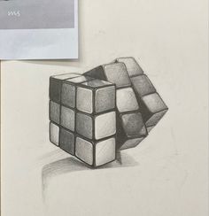 a pencil drawing of a cube on top of a piece of paper