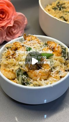 two white bowls filled with pasta and vegetables