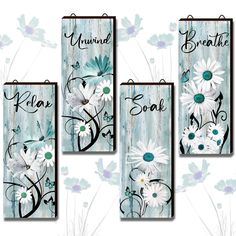 four wall hangings with flowers on them