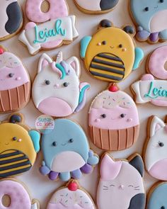 some decorated cookies are sitting on a table