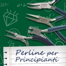 a book cover with scissors and writing on the page, which reads perline per principanti