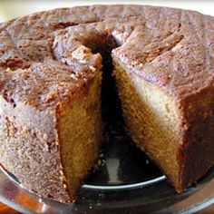 a cake that has been cut into pieces and is on top of a glass plate