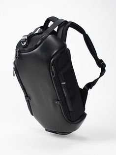 With a design that mirrors the natural structure of a carapace, the AVON is an expandable backpack that allows its storage capacity to be increased by unzipping and unclipping various sections throughout. The main compartment is accessed on the top of the bag using a drawstring entry which is secured using a zipper cover. A concealed compartment on the padded back panel of the AVON is accessed using a zipper-entry system. Part of our premium Alias range, the AVON is made from supple cowhide leat Soft Leather Backpack, Entry System, Mens Gym Bag, Mens Gym, Black Leather Backpack, Bag Design, Men's Backpack, Womens Backpack, Cowhide Leather