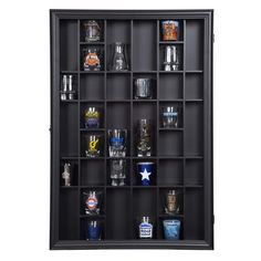 a black shelf with many glasses on it