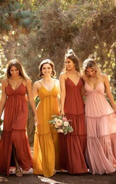 the bridesmaids are wearing different colored dresses