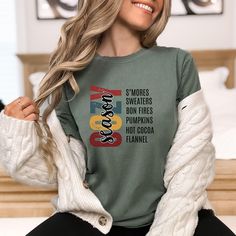 Order by December 10th to ensure arrival by Christmas. Embrace the warmth of autumn with this stylish Cozy Season shirt! Featuring "COZY" in bold vertical letters with "season" in a delicate script, this design captures the essence of crisp fall days and cozy nights by the fire. Perfect for layering with your favorite sweaters or jackets, this shirt is made with Comfort Colors fabric, known for its softness and relaxed fit. Available in earthy shades like Moss and classic Ivory, this tee is the Cozy Letter Print Tops For Fall, Fall Long Sleeve T-shirt With Letter Print, Fall Long Sleeve Letter Print T-shirt, Fall Letter Print Long Sleeve T-shirt, Long Sleeve Letter Print T-shirt For Fall, Hay Ride, Fall Wardrobe Staples, Fall Crewneck, Fall Shirts Women