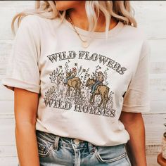 Wild Flowers Wild Horses Natural Shirt, Western Cowgirl Shirt, Trendy Western Shirt, Country Concert Shirt, Rodeo Graphic Shirt, Cute Cowgirl  Our T-shirts are made from premium materials and printed using advanced technology to ensure exceptional quality and comfort. Features: Premium brand: Gildan Soft Style Professionally printed using advanced technology Unisex size for a comfortable fit Made from soft, breathable cotton for all-day comfort Durable construction to withstand repeated wear and tear Easy Ordering: 1.Browse our design options. 2.Choose your size and color. 3.Choose the quantity you want. 4.Click "Add to Cart" to complete your purchase. Order Fulfillment: 💍Production time: 1-2 business days 💍Shipping time: 3-5 working days after production Return Policy: 💍Returns and exc Spring Band Merch Tops With Letter Print, Printed Cotton Band Merch Top, Band Merch Cotton Top With Funny Print, Vintage Custom Print Tops For Spring, Summer Band Merch Top With Funny Print, Band Merch Tops With Custom Print, Spring Band Merch T-shirt With Custom Print, Spring Band Merch Shirt With Relaxed Fit, Spring Graphic Print Band Merch Shirt