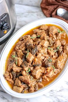 the slow cooker beef tips and gravy is ready to be cooked in the crock pot