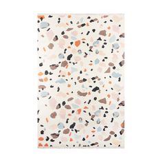 a white rug with multicolored spots on the front and back of it,