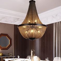 a chandelier hanging over a dining room table