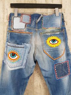 "Ready to send:Size 34 ,33,32,31 Unique vintage jeans with apcycled patches. One of a kind.. Hand made embroidery and unique painting .... ---Or---- Made to order, in any size, within 12 working days . If you need different size, please send me a message and I will make you a special and unique design within 12 working days. They are all different! No one will have the same one as you have! Hand painted, one of kind jeans. You pick your size, model (slime- boyfriend- high waist- low waist) and p Multicolor Denim Pants With Pockets, Multicolor Straight Leg Denim Pants, Retro Blue Jeans With Patch Pockets, Multicolor Jeans With Pockets, Retro Tapered Leg Pants With Five Pockets, Festival Straight Leg Jeans With Pockets, Festival Straight Leg Jeans, Blue Retro Pants With Five Pockets, Retro Blue Pants With Five Pockets