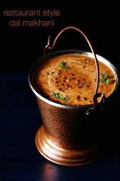 a pot filled with food sitting on top of a table