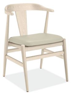 a white wooden chair with a seat cushion