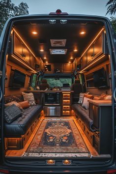 the interior of an rv with leather couches and rugs in the rear area