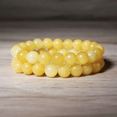 This stone bracelet is a stunning accessory that will brighten up your wrist and your mood. It is handmade with high-quality elastic cord and has a comfortable fit. It measures about 6.5 ~ 7 inches in length and can stretch to fit most wrists. The bracelet is easy to wear and take off, as it has no clasp or closure. This bracelet is perfect for anyone who loves boho chic style, natural stones. It is a unique and meaningful gift for yourself or someone special. You can wear it alone or stack it w Recycled Bracelets, Honey Calcite, Yellow Calcite, Natural Honey, Calcite Crystal, Woven Bracelets, Healing Bracelets, Spiritual Healing, Nature Bracelets