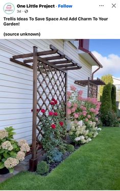 an outdoor garden with flowers and trelliss next to a house