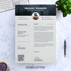 a clean and professional resume is displayed on a desk next to a keyboard, mouse, and plant