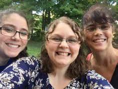 three women are taking a selfie in the park