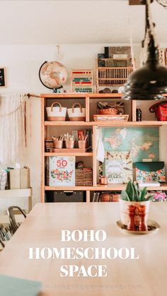 a wooden table topped with a potted plant next to a shelf filled with books