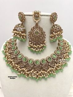 Antique Gold Polki Necklace Set comes with Jhumki earrings and tikka / Indian Jewelry/ High Quality Kundan and Polki Jewelry/ Bollywood Jewelry/Wedding Jewelry/mint/sage green/pista   All items are shipped from Brampton, Ontario, Canada. If you need your item by a certain day, please reach out to us for express delivery option before placing the order so that we can update the shipping for you. Standard shipping/delivery timeline Below are the delivery timeline estimates once the order ia shippe Sage Green Indian Jewelry, Green Kundan Chandbalis For Reception, Green Jewelry Sets With Intricate Design For Reception, Green Bollywood Chandbalis For Reception, Green Chandbalis For Diwali Reception, Green Chandbalis For Reception And Diwali, Green Lehenga With Stone Work For Reception, Green Kundan Chandbalis For Wedding, Green Chandbalis With Zari Work Bollywood Style