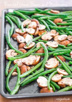 green beans and mushrooms on a baking sheet