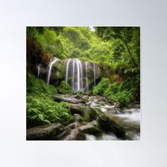 a waterfall surrounded by lush green trees and rocks poster print with water running down it's side