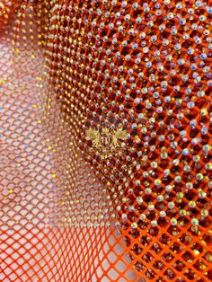 an orange net with lots of small dots on it