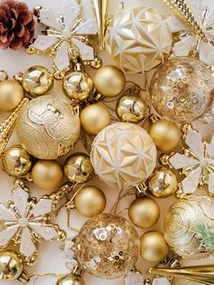 christmas ornaments and pine cones on a table