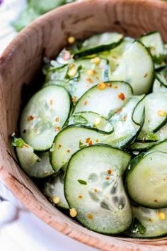 cucumber salad in a wooden bowl on a table