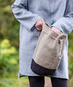 a woman holding a bag in her hands