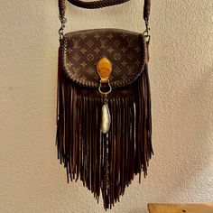 Large Messenger Style, Vintage Louis Vuitton Crossbody Purse In Excellent Condition. Leather Purse With Dark Leather, Boho Fringe. Purse Restyled By Vintage Boho Bags. Zippered Pocket Inside And Open Pocket On The Outside. Large: Width: 9.5"X Height: 9.5" Depth: 3" Fringe Length: 12" Braided Leather Crossbody Strap: 47" From A Smoke-Free Home. Louis Vuitton Fringe Crossbody Bag, Louis Vuitton Crossbody, Fringe Purse, Boho Fringe, Fringe Bags, Boho Bags, Vintage Louis Vuitton, World Traveler, Braided Leather