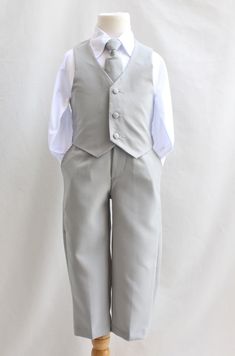 Classic cut formal suit with all the items required for any formal events. The sets include: White Dress shirt with pin tuck front, fully lined vest, adjustable neck tie, classic cut jacket, formal pants. The main parts of the suits are made from polyester with the shirt made from a poly-cotton blend. Your little man will surely be a stand out with this perfect suit in any events. PLEASE SEE OUR PICTURE COLLECTION FOR THE COMPLETE SIZE CHART Product Features: * 5-Piece MATCHING suit set, perfect Classic Gray Suit And Tie Accessories For Wedding, Classic Gray Tuxedo For Formal Occasions, Classic Gray Suits For Wedding, Gray Three-piece Suit For Formal Occasions, Classic Wedding Tuxedo, Jacket Formal, White Dress Shirt, Formal Suit